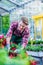 Dedicated florist during work in a modern flower shop