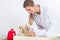 Dedicated pediatrician using the stethoscope during the check-up