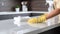 Dedicated Woman Cleaning Countertop with Disinfectant Spray AI Generated