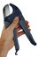 Deep blue coloured plastic tube cutting tool pliers held in left hand, white background.