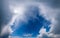 Deep blue fantastic sky with clouds formed window and sunshine through cloud (wide natural cloudscape background panorama