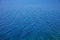 Deep blue sea water surface. Calm sea background texture