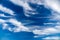 Deep blue sky with picturesque stratus clouds