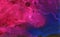 Deep dark blue, pink and purple alcohol ink neon abstract background. Flow liquid watercolor paint splash