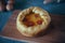 Deep Dish Pizza. Ð¡hicago pizza 4 cheeses, dried cherry tomatoes. Food on a wooden plate, rolling pin and 4 eggs, recipe pie pizza