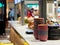 Deep dishes stacked in piles on a kitchen counter in a fast food restaurant. Kitchen objects on a blurred background