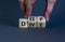 Deep dive symbol. Businessman turns wooden cubes with words `Deep dive`. Beautiful grey background. Deep dive and business conce