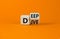 Deep dive symbol. Turned a wooden cube with words `Deep dive`. Beautiful orange table, orange background. Deep dive and business