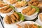 Deep fat fried food in plates on cafe shop shelf