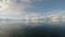 Deep fjord view with snowy mountain and long beautiful bridge