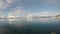 Deep fjord view with snowy mountain and long beautiful bridge