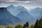 Deep forested valleys with snowy peaks in Julian Alps Slovenia