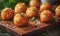 Deep fried arancini balls on wooden board - traditional Italian cuisine. Stuffed rice balls