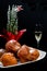 Deep fried buns oliebol and a glass of champagne is a typical Dutch tradition to celebrate new years eve in the Netherlands