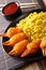 Deep fried crab claws in breadcrumbs of surimi with spicy yellow