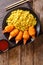 Deep fried crab claws in breadcrumbs of surimi with spicy yellow