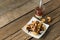 Deep-fried dough stick and coffee on wooden to creative