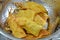 Deep fried needle mushroom wrap in dumpling flour on colander