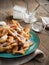 Deep-fried pastry on wooden table.