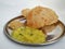 Deep fried Poori or Puri served with spicy potato onion curry and Coconut Chatney. It is an unleavened deep-fried bread