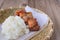Deep fried pork with sticky rice on wood basket, thai food, thai