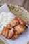 Deep fried pork with sticky rice on wood basket, thai food, thai