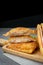 Deep fried sandwich stuffed tuna in wooden dish on table