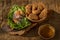 Deep-fried shrimp cakes Tod Mun Goong and vegetable with chili sauce on wooden background