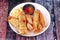 Deep fried spring roll,and frence fries sreved with tomato souce and chili sauce.