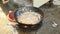 Deep-frying bulfrogs in a wok over a household stove ( close up )