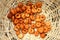 Deep frying medu vada in the basket . Medu Vada is a savoury snack from South India, very common street food in the India.