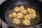 Deep frying pork and shrimp dumplings