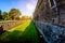 A deep moat and high wall of an ancient fortress Castello Sforzesco Sforza Castle in Milan