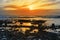 Deep orange reflections at rocky beal beach