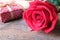 Deep red rose on wooden floor. Backdrop for Valentine's day concept