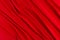 Deep red silk smooth background with copy space. Abstract passion love backdrop.