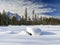 Deep snow covers a public camping spot with picnic table