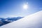 Deep snow untouched swiss mountain panorama against blue sky with copy space