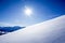 Deep snow untouched swiss mountain panorama against blue sky with copy space