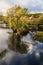 Deep water reflections of trees in the river Esk at Ruswarp, North Yorkshire