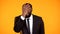 Deeply disappointed and shocked african-american male in suit making facepalm