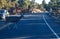 A deer crosses Desert View Drive in Grand Canyon National Park to get to the forest, stopping traffic in late afternoon