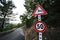 Deer crossing road sign and fifty kilometers per hour speed limit