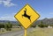 Deer crossing sign on the road