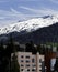 Deer Mountain with snow on it and buildings in the forground.