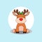 A deer sits on the floor. Christmas. New Year. Winter