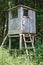 Deer stand in a forest, vertical view