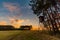 Deer stand tree stand beside field and forest at sunset light, Czech republic