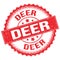 DEER text on red round stamp sign