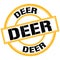 DEER text on yellow-black round stamp sign